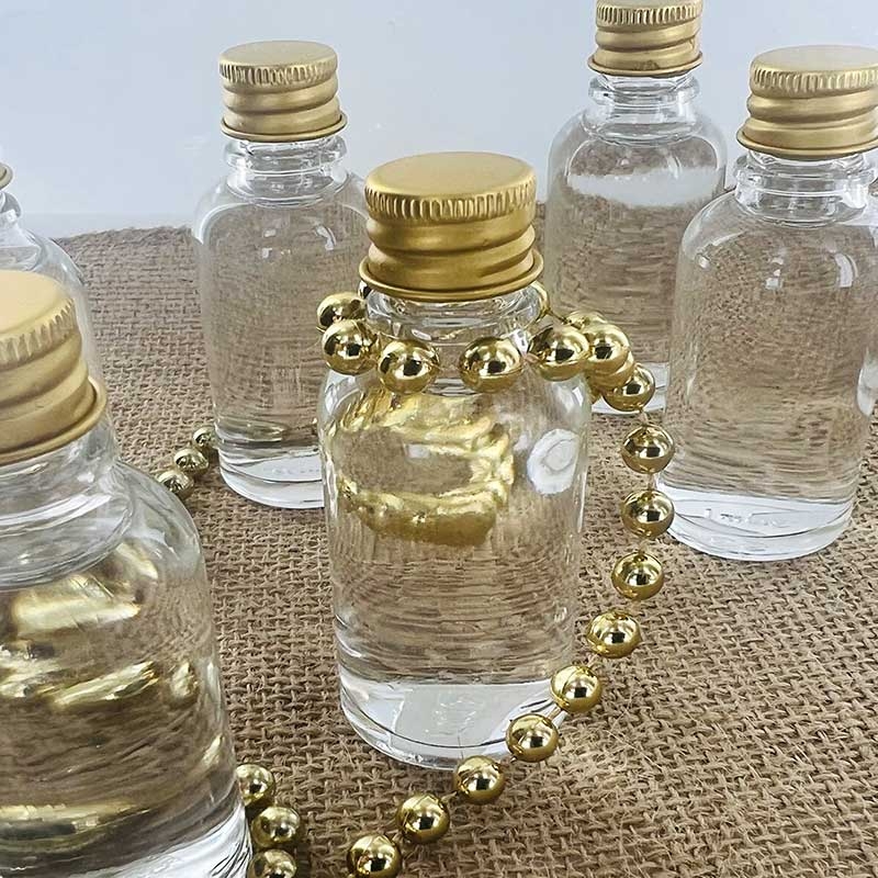 Mini bouteille en verre et bouchon métal à vis - pièce